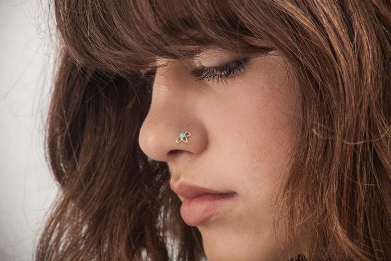 Women wear fine nose studs