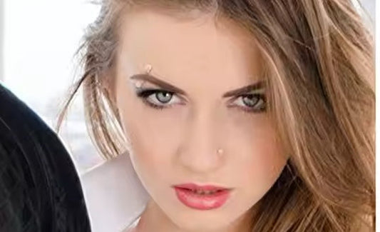Women wearing transparent eyebrow nails