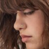 Women wear fine nose studs
