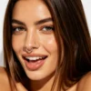A woman confidently displays her Mantis piercing